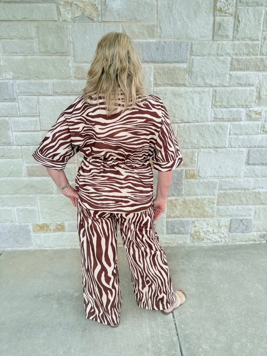 Wild & Refined: Zebra Print Drawstring Waist Button-Front Top