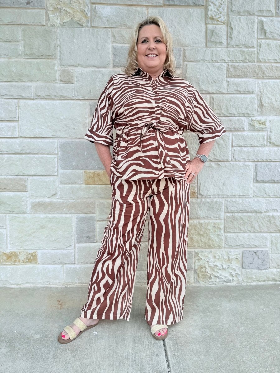 Wild & Refined: Zebra Print Drawstring Waist Button-Front Top